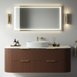 Bathroom vanity with a large illuminated mirror above it, featuring a wooden cabinet and white countertop.