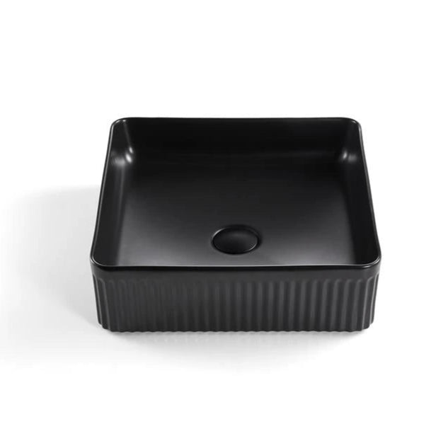 Black rectangular basin with ribbed texture on a white background