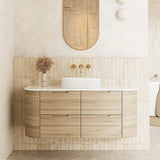 Valco 1200mm large curved wall hung plywood vanity in a luxury master bathroom, featuring a Nature Oak timber look, expansive 500mm deep benchtop, and elegant styling.