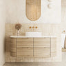Valco 1200mm large curved wall hung plywood vanity in a luxury master bathroom, featuring a Nature Oak timber look, expansive 500mm deep benchtop, and elegant styling.