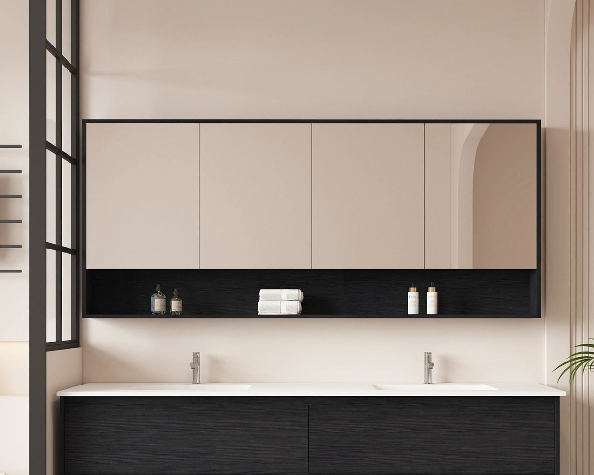 Modern bathroom with black and white vanity, mirror, and toiletries.