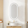 Athena pill oval LED shaving cabinet 450 x 900mm in matte white with the front LED light on, mounted above a bathroom vanity