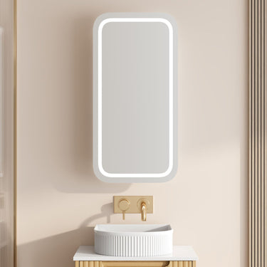 Athena rectangle LED shaving cabinet 450 x 900mm in matte white with the front LED light on, mounted above a bathroom vanity