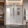 Brushed gun metal frameless 3 panel sliding shower screen with centre sliding door across a wide marble shower recess