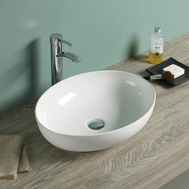 Carey 520mm oval above counter basin in gloss white on a timber vanity top