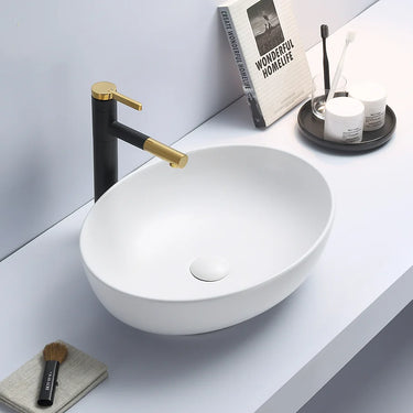 Carey 520mm oval above counter basin in matte white on a white bathroom bench