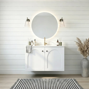 Chester 600mm Matte White Hampton wall hung vanity with arched doors, styled bathroom