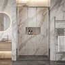 Chrome semi frameless 3 door sliding shower screen in a marble wall to wall shower recess