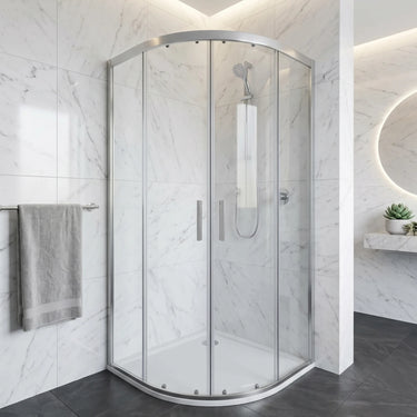 Chrome semi frameless curved sliding shower screen in a white marble bathroom corner