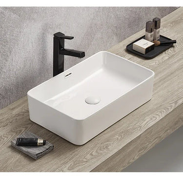 Crete 555mm rectangular above counter basin in gloss white on a bathroom vanity top with overflow
