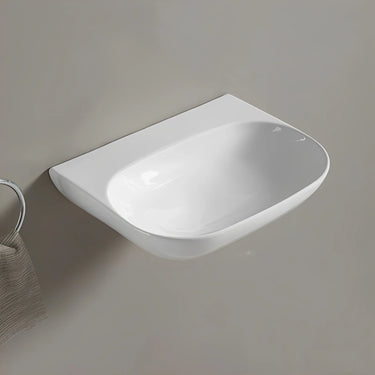 Ellips 500mm gloss white wall hung basin with no tap hole mounted on a wall