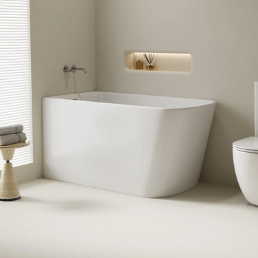 Harvard 1300mm small rectangular corner bath in gloss white installed in the corner of a compact bathroom