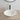 Kirra 500mm solid surface stone oval above counter basin in matte white on a timber vanity