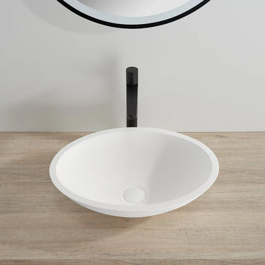 Kirra 500mm solid surface stone oval above counter basin in matte white on a timber vanity