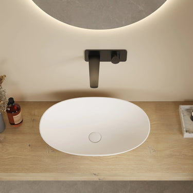 Kirra 580mm solid surface stone oval above counter basin in matte white with wall mixer