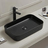 Kliff 605mm rectangular above counter basin in matte black on a bathroom vanity top