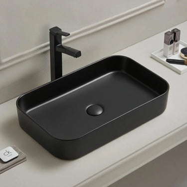 Kliff 605mm rectangular above counter basin in matte black on a bathroom vanity top