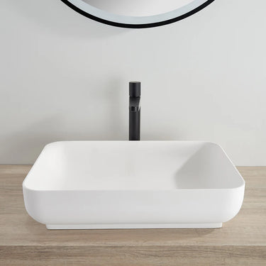 Kliff 550mm solid surface stone above counter basin in matte white on a timber vanity with black tall mixer