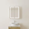 600mm matte white LED shaving cabinet mounted above a timber vanity with a fluted above counter basin