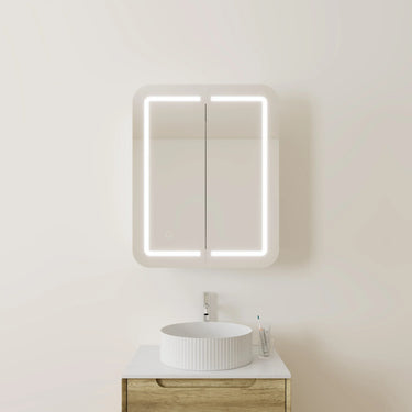 600mm matte white LED shaving cabinet mounted above a timber vanity with a fluted above counter basin