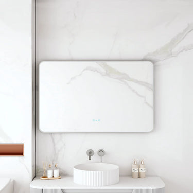 Maia 1200x750mm rectangular motion sensor LED mirror with gun metal frame in a bathroom above a round basin