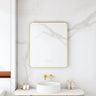 Maia 600x750mm rectangular motion sensor LED mirror with brushed gold frame in a bathroom above a round basin