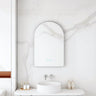Maia 600x900mm arch motion sensor LED mirror with brushed nickel frame in a bathroom above a round basin