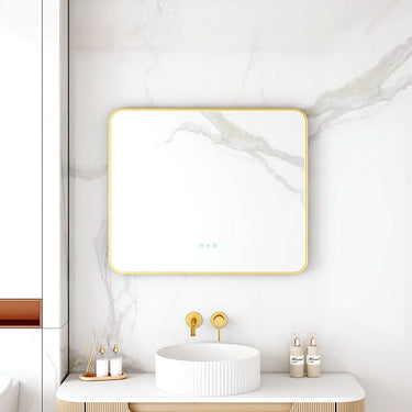 Maia 900x750mm rectangular motion sensor LED mirror with brushed gold frame in a bathroom above a round basin