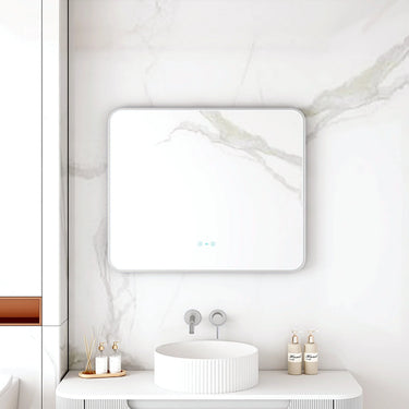 Maia 900x750mm rectangular motion sensor LED mirror with brushed nickel frame in a bathroom above a round basin
