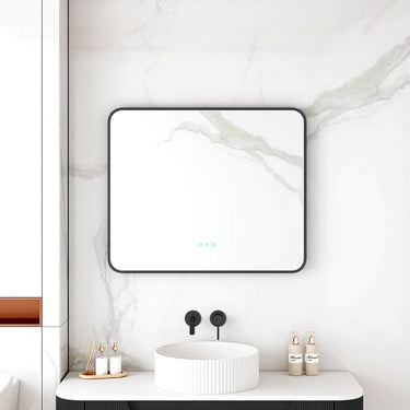 Maia 900x750mm rectangular motion sensor LED mirror with matte black frame in a bathroom above a round basin