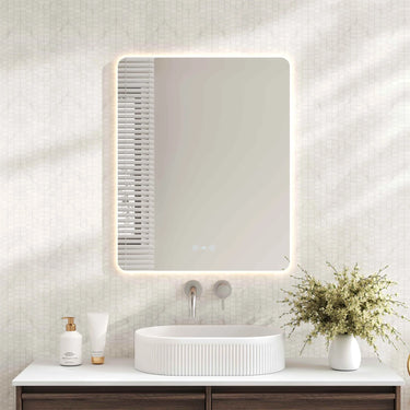 Mercio Luna 600x750mm rectangular frameless backlit LED mirror in a bathroom above a round basin