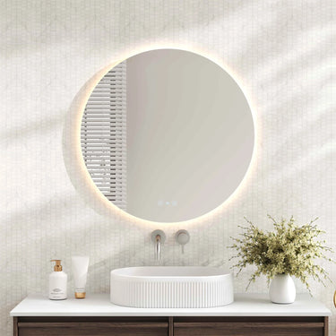 Mercio Luna 900mm round frameless backlit LED mirror in a bathroom above a round basin