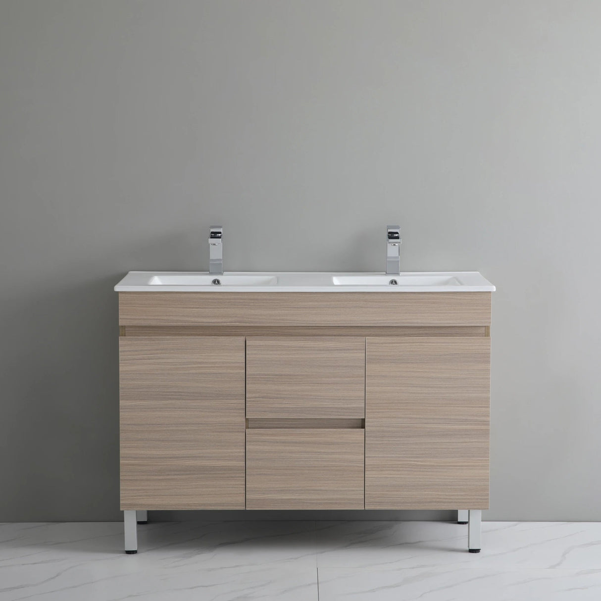 Bathroom vanity with two sinks against a gray wall