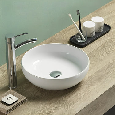 Oban 377mm round above counter basin in gloss white on a bathroom vanity top