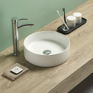Olley 350mm round above counter basin in gloss white on a bathroom vanity top