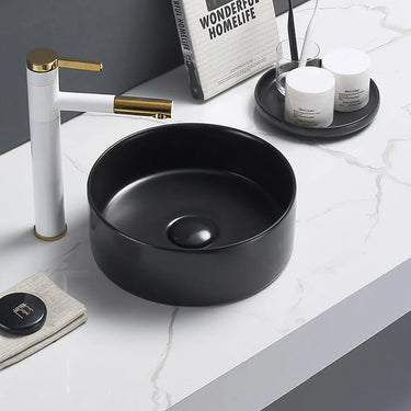 Olley 350mm round above counter basin in matte black on a bathroom vanity top