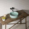 Olley 395mm round above counter basin in matte mint green on a bathroom vanity top