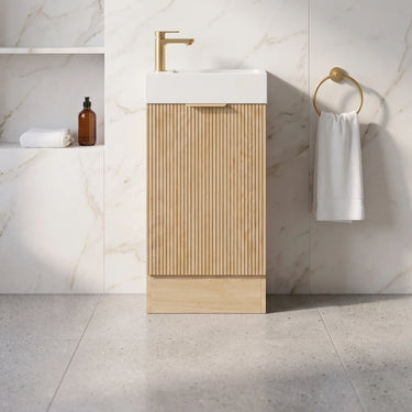 Scandinavia 450mm Classic Oak Fluted Freestanding Vanity with kickboard and poly marble basin top in a marble powder room - RJ Bathroom