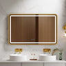 Venus 1200x750mm rectangular front-lit motion sensor LED mirror with brushed gold frame in a bathroom above a round basin