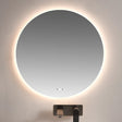 Round illuminated mirror above a sink in a bathroom setting
