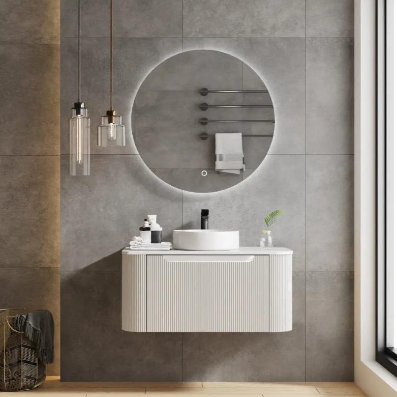 white wall hung vanity with white round basin and a round LED mirror on the wall