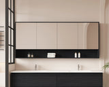 Modern bathroom with black and white vanity, mirror, and toiletries.