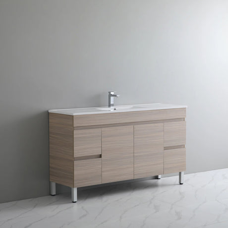 Bathroom vanity with sink against a gray wall