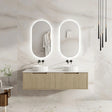 Bathroom vanity with two sinks and illuminated mirrors in a modern setting.