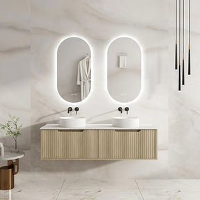 Bathroom vanity with two sinks and illuminated mirrors in a modern setting.