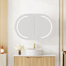 Athena pill oval LED shaving cabinet 900mm in matte white with the front LED light on, mounted above a bathroom vanity