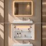 Avola 900mm matte white LED shaving cabinet installed above a bathroom vanity, shown closed with the LED on and opened to reveal the glass shelves