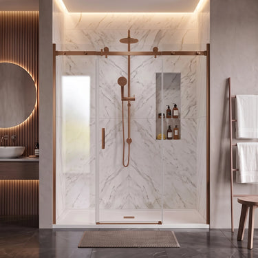 Brushed bronze (copper) frameless 3 panel sliding shower screen with centre sliding door across a wide marble shower recess
