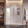 Brushed gold frameless 3 panel sliding shower screen with centre sliding door across a wide marble shower recess