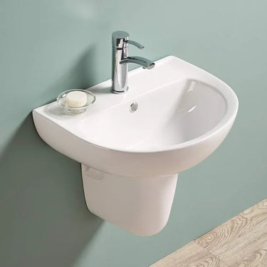 Carrida 565mm gloss white wall hung care basin with tap hole, shown with half pedestal which is not included